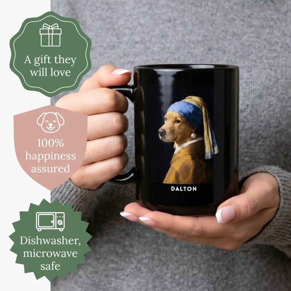 Hands holding a black mug showing a golden retriever in a blue and gold turban with a pearl earring, named "DALTON". Badges read "A gift they will love", "100% happiness assured" and "Dishwasher, microwave safe".