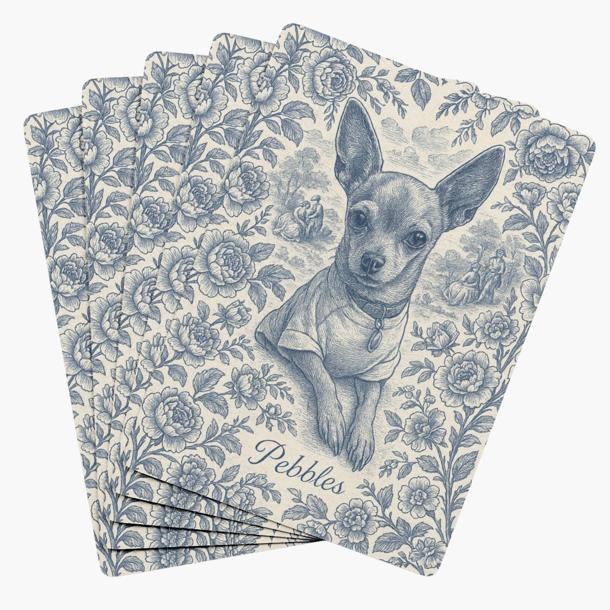 Five playing cards fanned face down, each back printed with a blue-on-cream toile engraving of a chihuahua framed by roses, with the name Pebbles below.