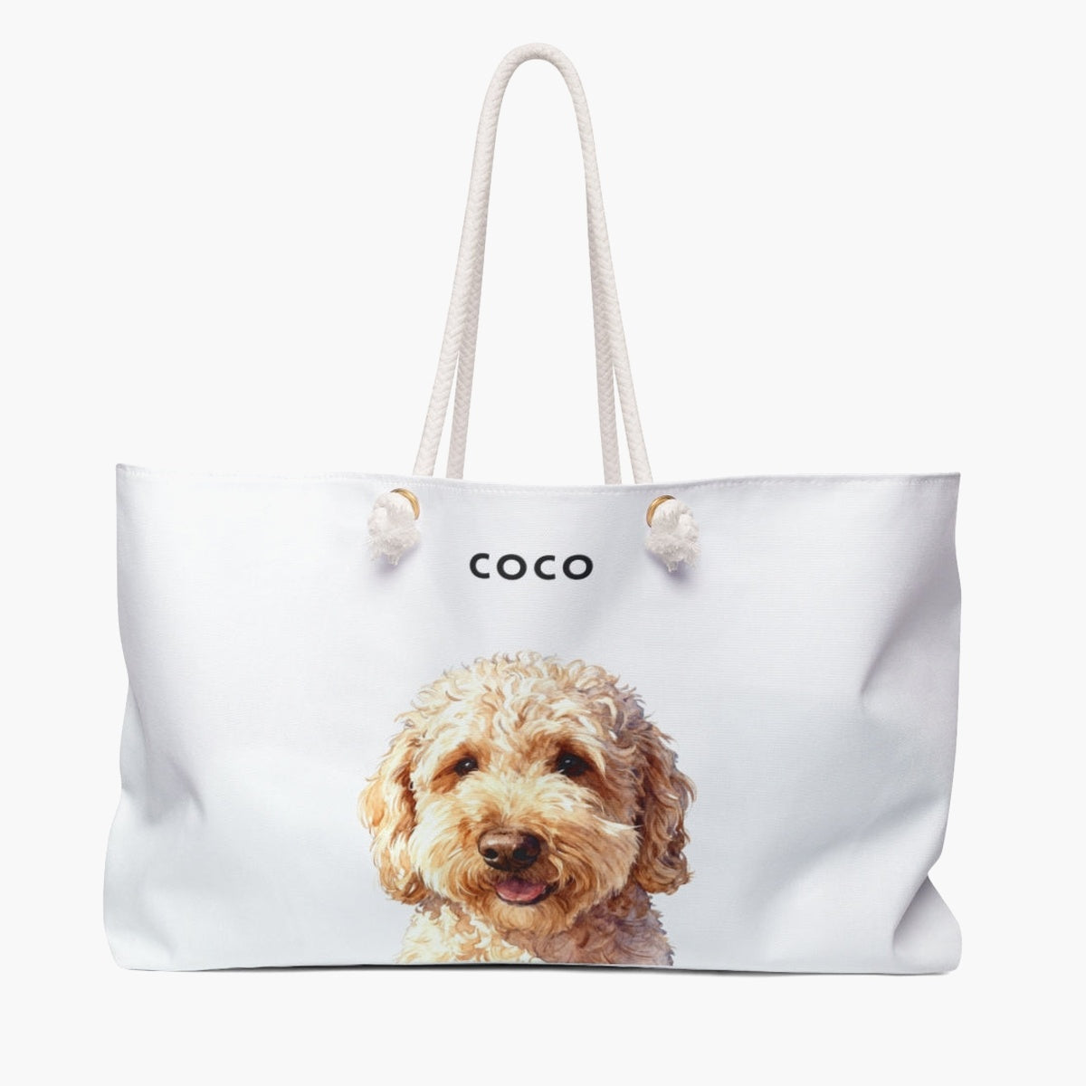 Watercolor portrait of an apricot doodle dog on a soft white weekender bag with white rope handles, with the name COCO printed above.
