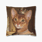 Renaissance-style oil painting of an Abyssinian cat wearing a jeweled gold crown and pearl necklace, on an 18-inch throw pillow.