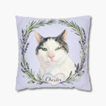 Watercolor gray and white cat inside a wreath of lavender and rosemary on a pale lilac throw pillow, with the name "Chester" in a heart below.