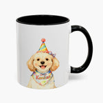 Watercolor cream doodle in a rainbow party hat on an 11 oz white mug with a black handle, the name Kankan lettered on its bandana.