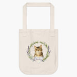 Natural cotton tote bag printed with a rosemary and lavender wreath around a brown tabby cat, with "Smokey" in script on a heart.