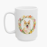 Watercolor portrait of a corgi with its tongue out in a pastel tulip wreath on the larger white mug, with the name Raine below.