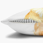 Close-up of the white pillow cover's edge with the concealed zipper open, showing the gray striped pillow insert inside.