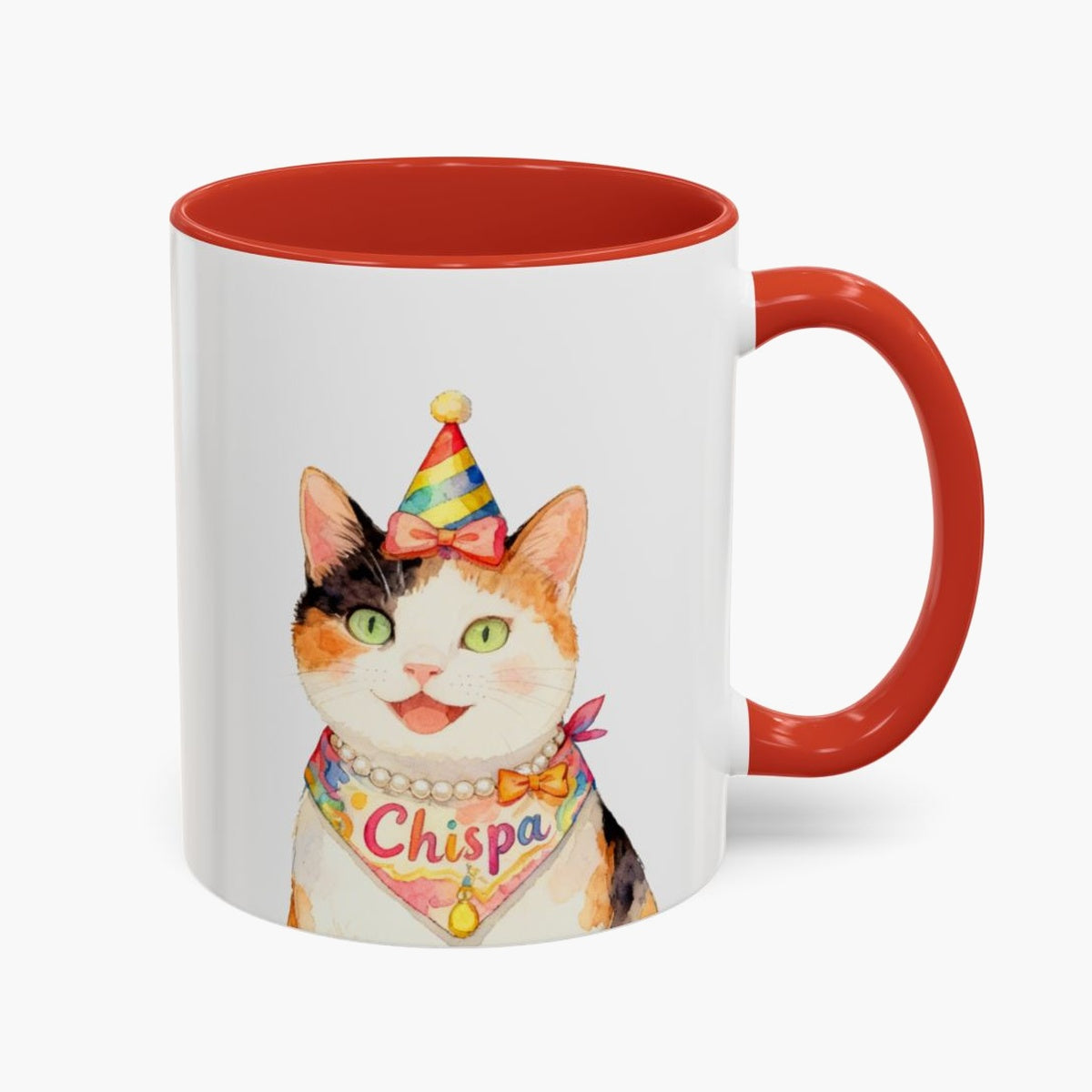 Watercolor calico cat in a party hat and pearl necklace on an 11 oz white mug with a red handle, the name Chispa on its bandana.