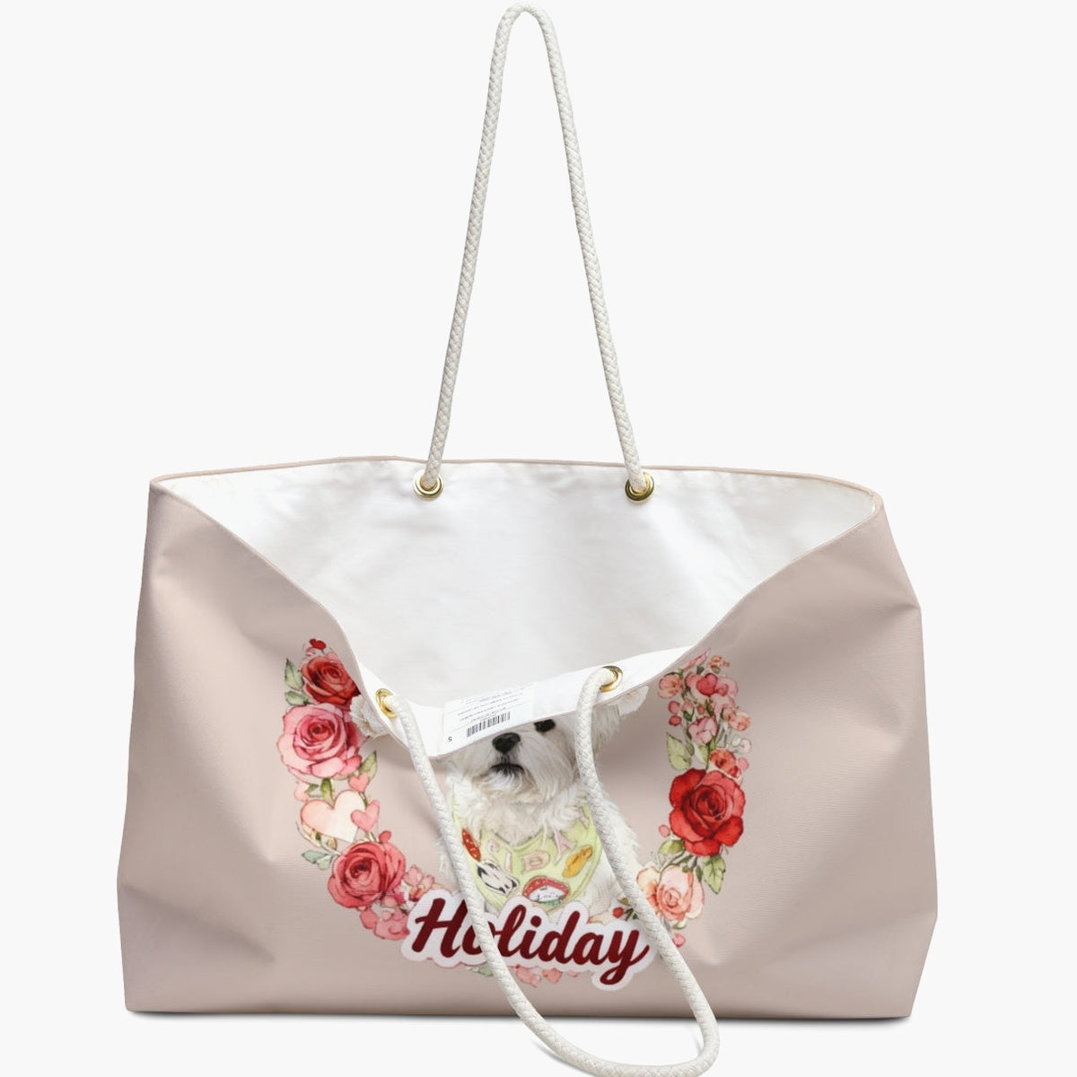 The blush rose-wreath weekender bag standing open, white lining and care label showing, with the white dog and "Holiday" lettering below.