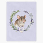 Lilac fleece blanket printed with a brown pet mouse inside a rosemary and lavender wreath, with the name "Joel Mouse" in a heart below.