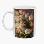 Oil-painting style print of a brown tabby cat surrounded by pastel tulips, wrapped around a white mug.