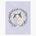Lilac fleece blanket printed with a gray and white cat inside a rosemary and lavender wreath, with the name "Chester" in a heart below.