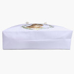 The lilac herb-wreath weekender bag laid on its side, showing the flat base and gusset, the tabby cat design just over the top edge.
