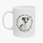 Watercolor portrait of a gray and white whippet inside a rosemary and lavender wreath on the 11 oz white mug, with the name Dash below.