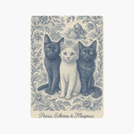 A single card back engraved in blue on cream with three cats sitting side by side in a floral border, named Prius, Eikona & Magnus below.