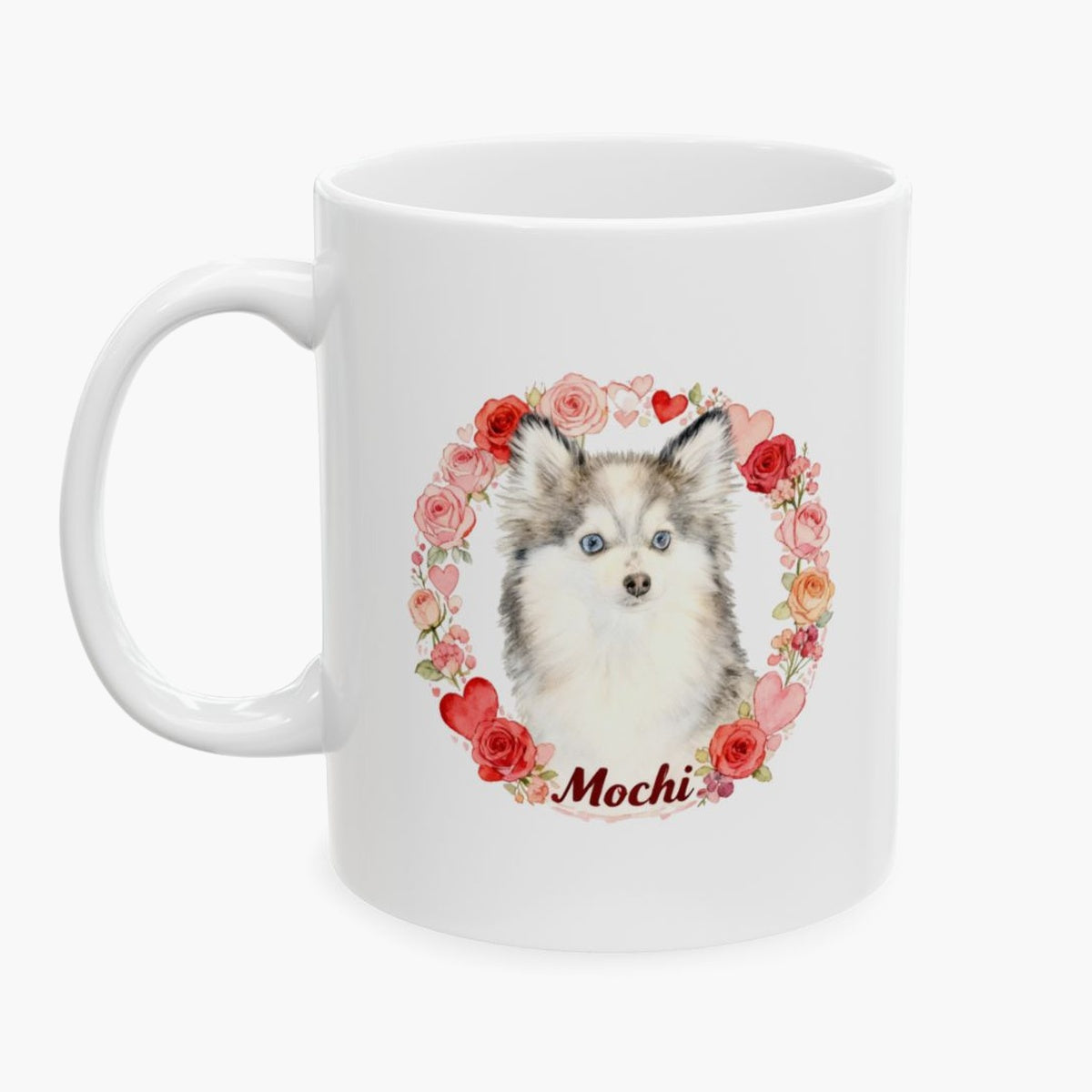 Fluffy husky-type puppy inside a wreath of roses and hearts on the 11 oz white mug, with the name Mochi in dark red script below.
