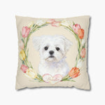 Watercolor white Maltese puppy inside a wreath of pink, orange and cream tulips on a cream pillow, the pet's name in script on a heart.