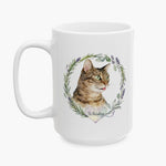 Watercolor portrait of the winking tabby cat Whiskey in a rosemary and lavender wreath, printed on the taller white mug.