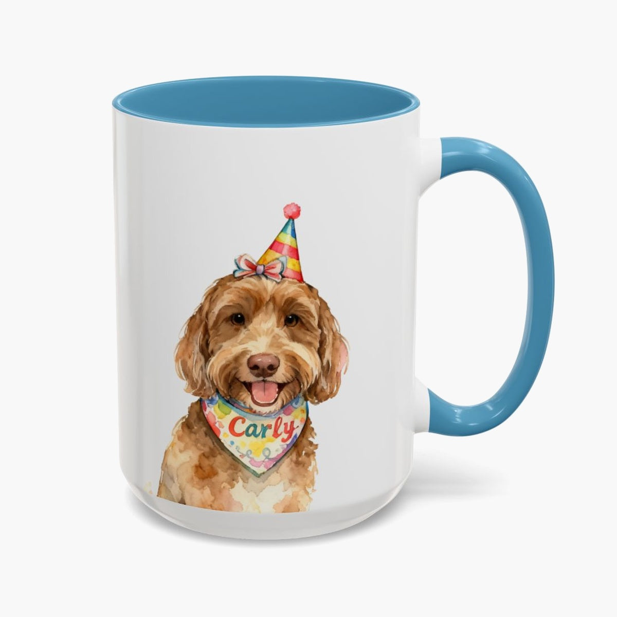 Watercolor brown labradoodle in a rainbow party hat on the taller 15 oz mug with a light blue handle, the name Carly on its bandana.