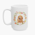 Watercolor portrait of a golden retriever in a pastel tulip wreath on the larger white mug, with the name Reddy on a heart below.