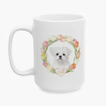 Watercolor portrait of a fluffy white Maltese in a pastel tulip wreath on the larger white mug, with the pet's name on a heart below.