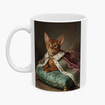 Oil painting of a ginger Abyssinian cat in a jeweled collar and pink ermine-trimmed royal cloak, lounging on a mint silk cushion, wrapped around a white 11 oz mug.