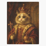 Fleece blanket printed with a cream long-haired cat as a Renaissance monarch, in a jeweled crown and red robe holding a scepter and orb.
