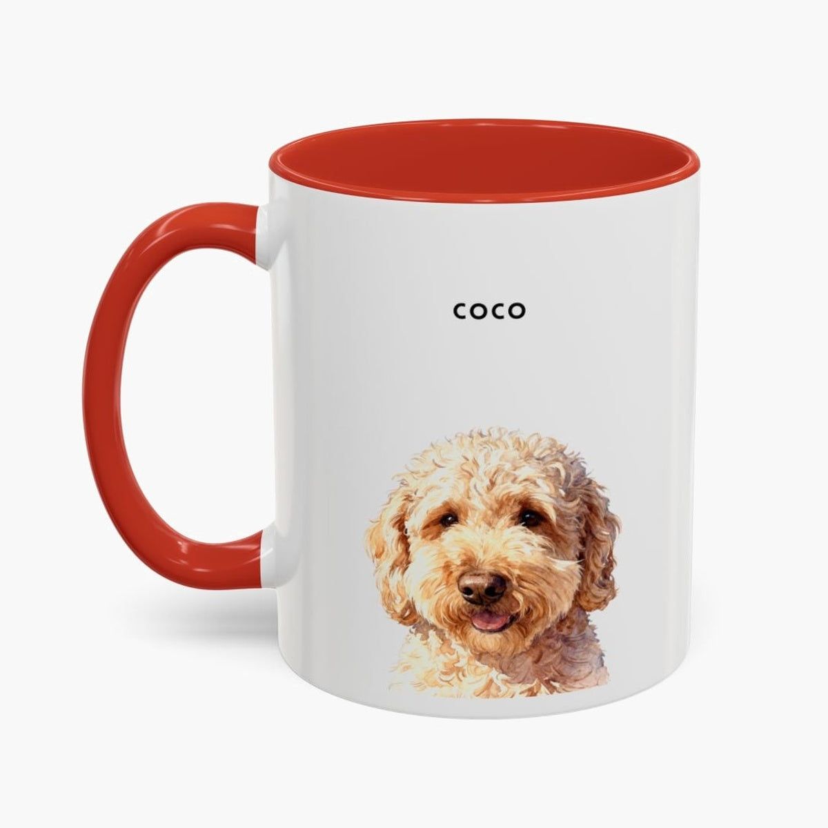 Watercolor head-and-shoulders portrait of an apricot goldendoodle on a white 11 oz mug with a red handle and inner glaze, name "COCO" above.