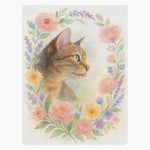 Off-white fleece blanket printed with a tabby cat in profile inside a pastel wreath of pink roses, daisies and lavender.