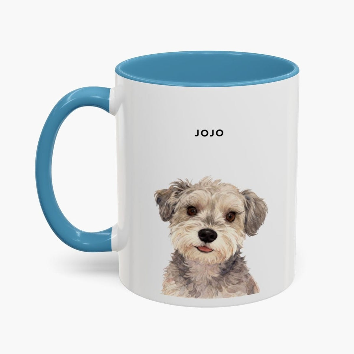 Watercolor head-and-shoulders portrait of a scruffy gray and cream terrier on a white 11 oz mug with a light blue handle and inner glaze, name "JOJO" above.