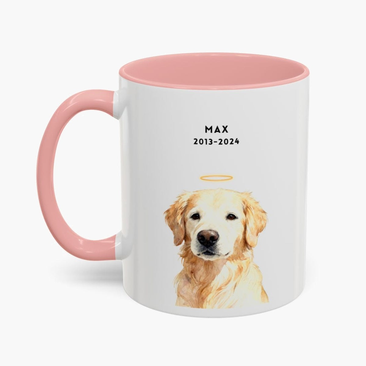 Watercolor golden retriever wearing a gold halo on a white 11 oz mug with a pink handle and inner glaze, lettered "MAX" and "2013-2024".